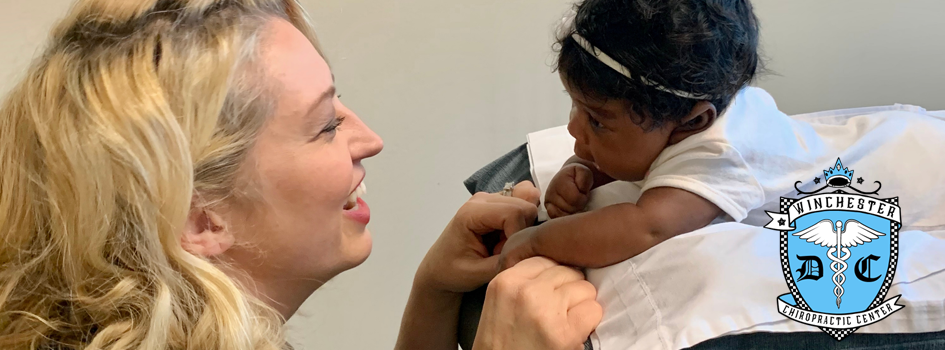 Dr. Henrickson is with a child patient checking in on how the patient is doing.