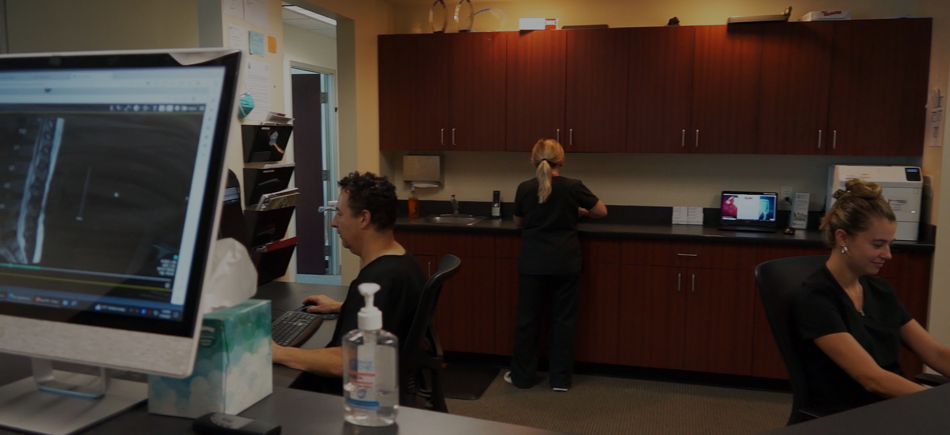 We find some of the Winchester Chiropractic Center doctors and assistants working at the central stations within the office.